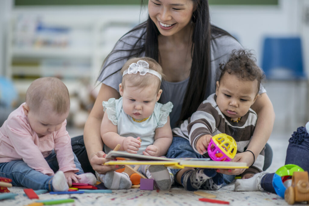 teacher reading to babies